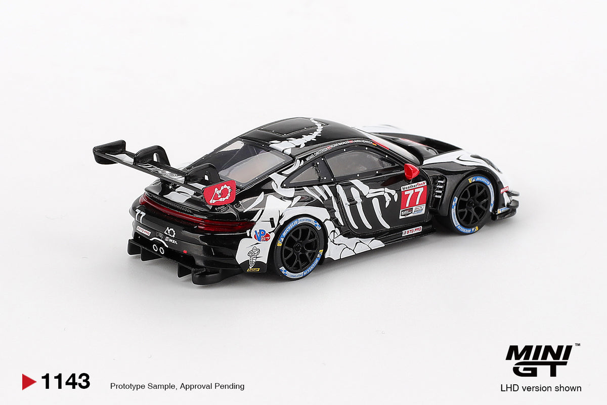 Mini GT Porsche 911 GT3 R #77 AO Racing 2025 IMSA Petit Le Mans Skeleton Rexy Halloween 1:64 Scale Diecast Model, view 3 | Toyfessional